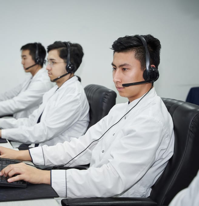 3 people working at computers